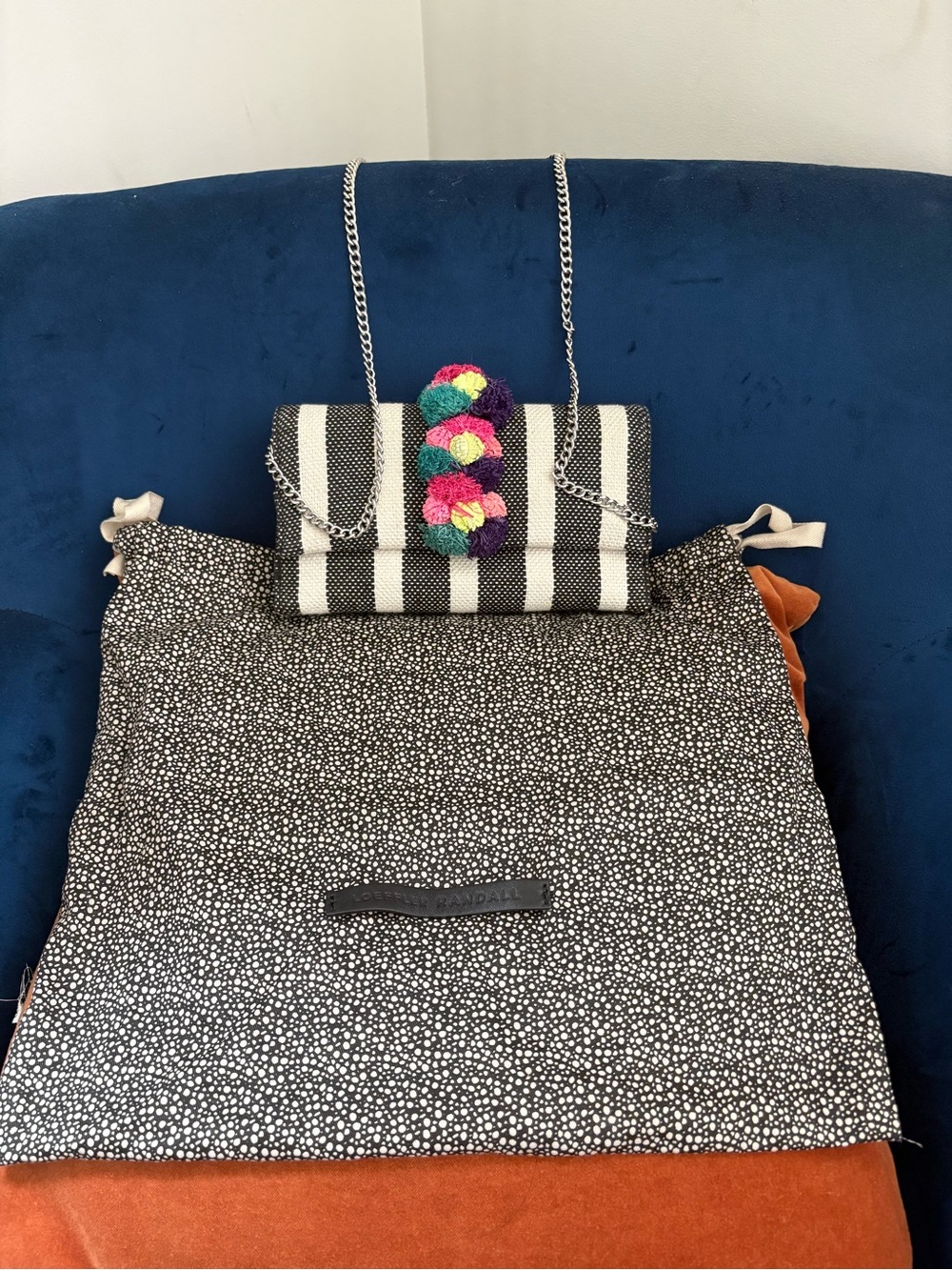 Loeffler Randall Black and White Striped Crossbody with Multicolor Pom Detail